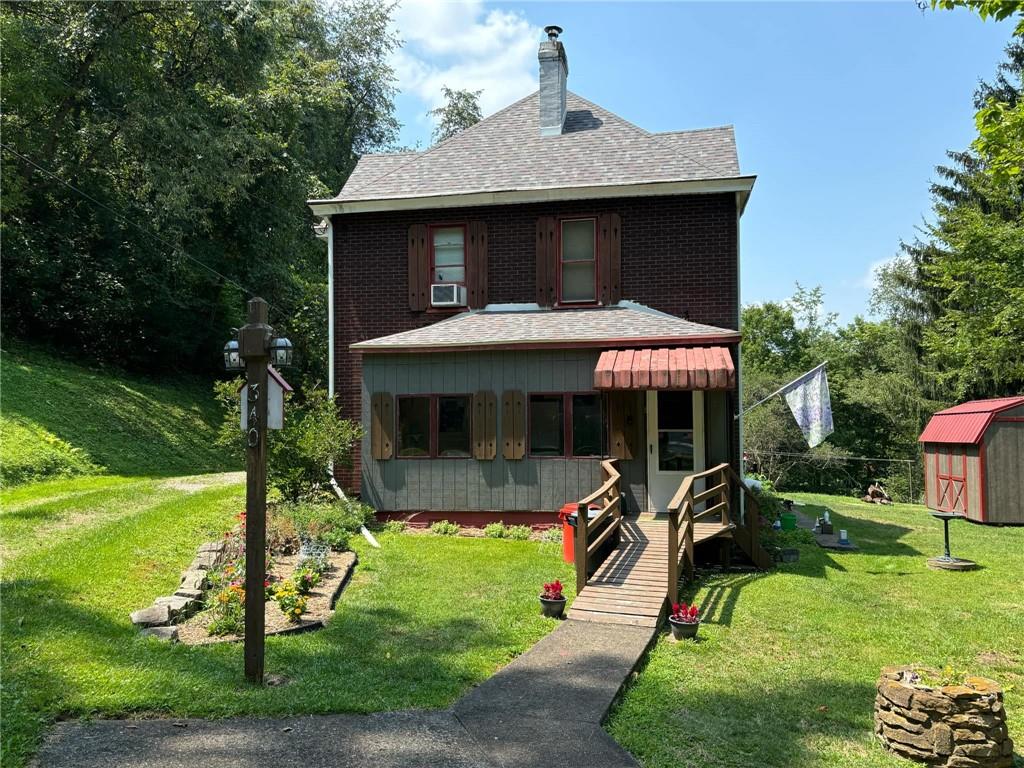 a front view of a house with garden