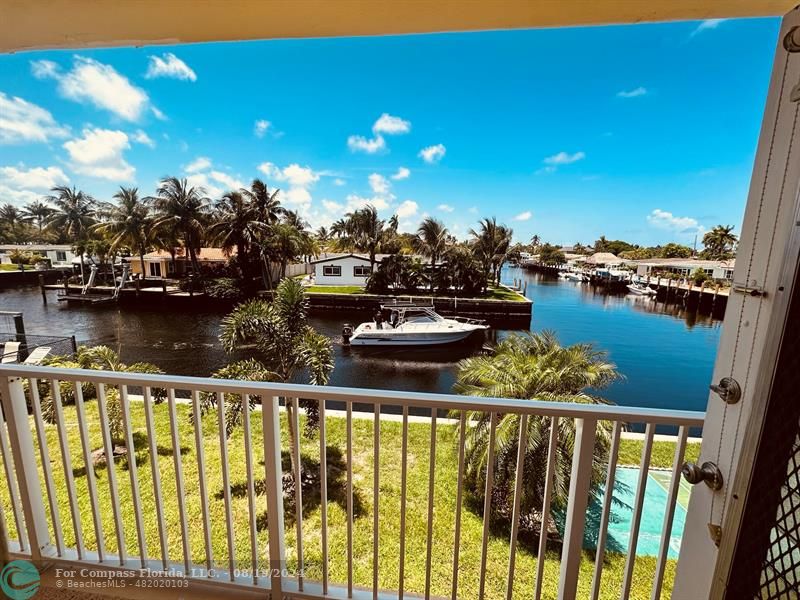 a view of a lake from a balcony