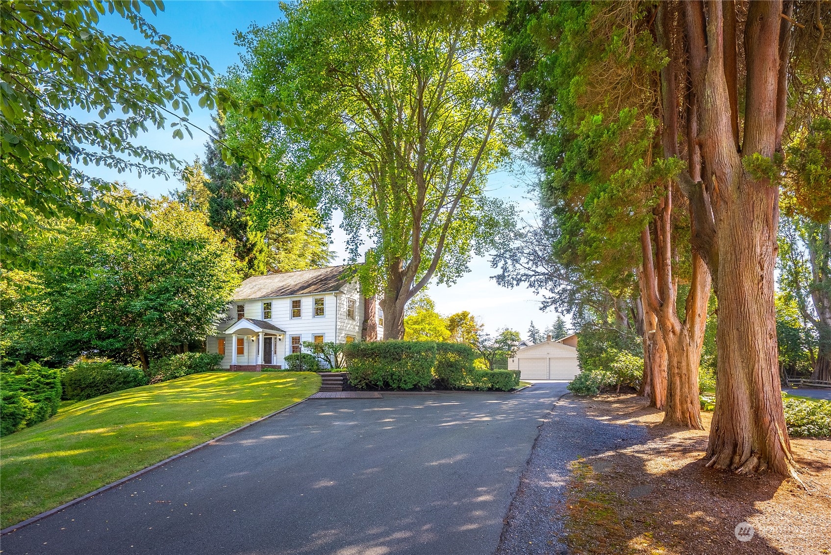 a view of house with outdoor space and trees