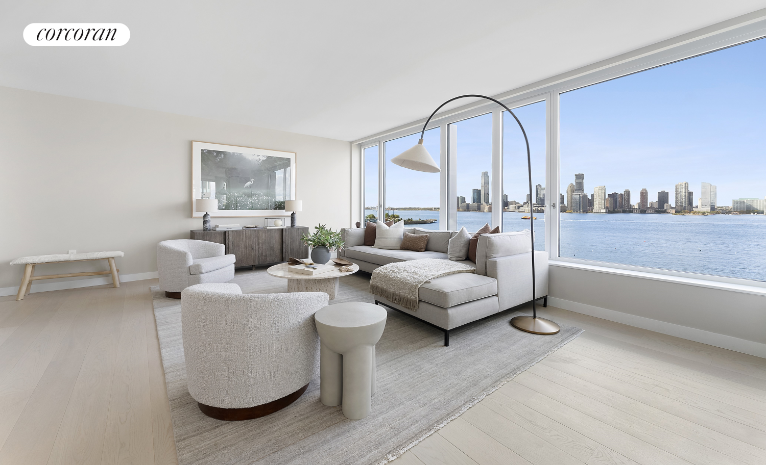 a living room with furniture and a floor to ceiling window