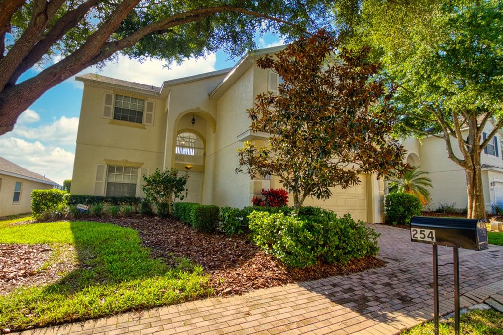 front of home with paved driveway