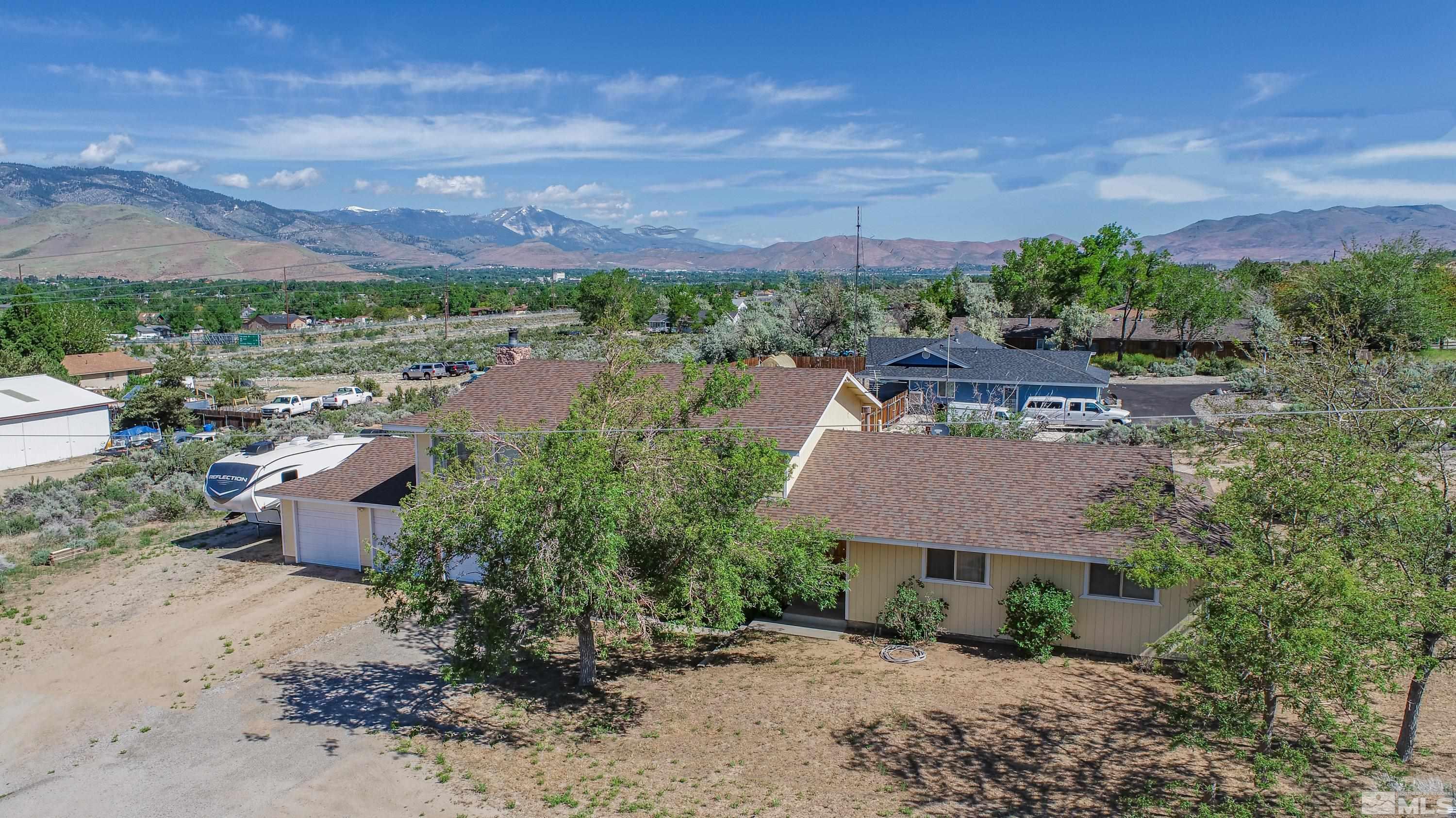 an aerial view of a house with a garden