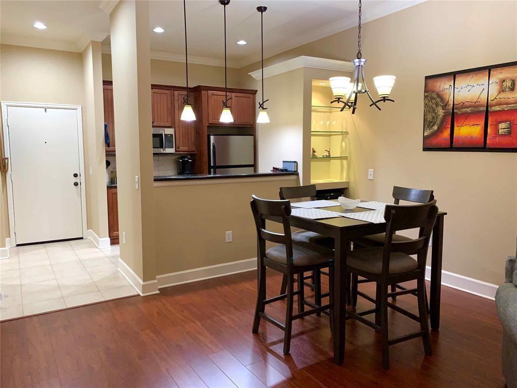 a kitchen with a table and chairs in it