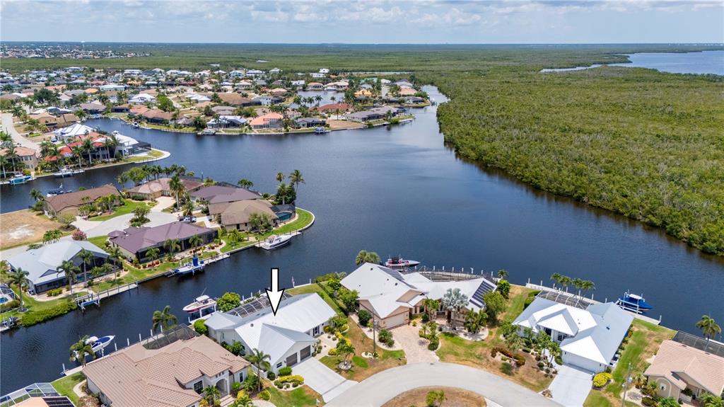 an aerial view of a house with a ocean view