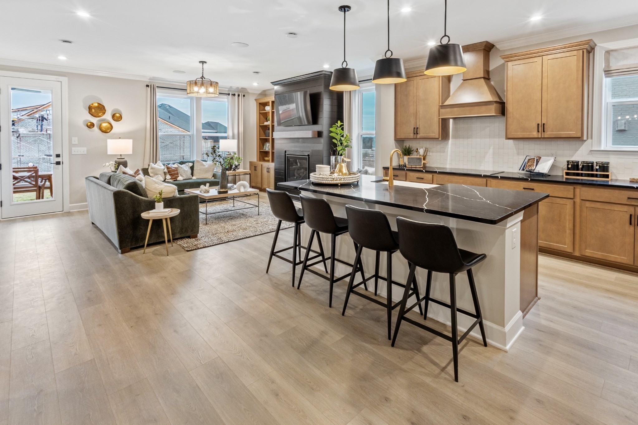 a kitchen with stainless steel appliances kitchen island granite countertop a sink and cabinets