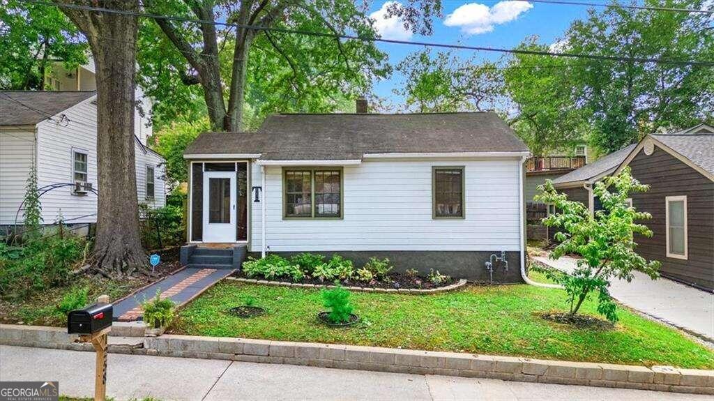 a front view of a house with a yard