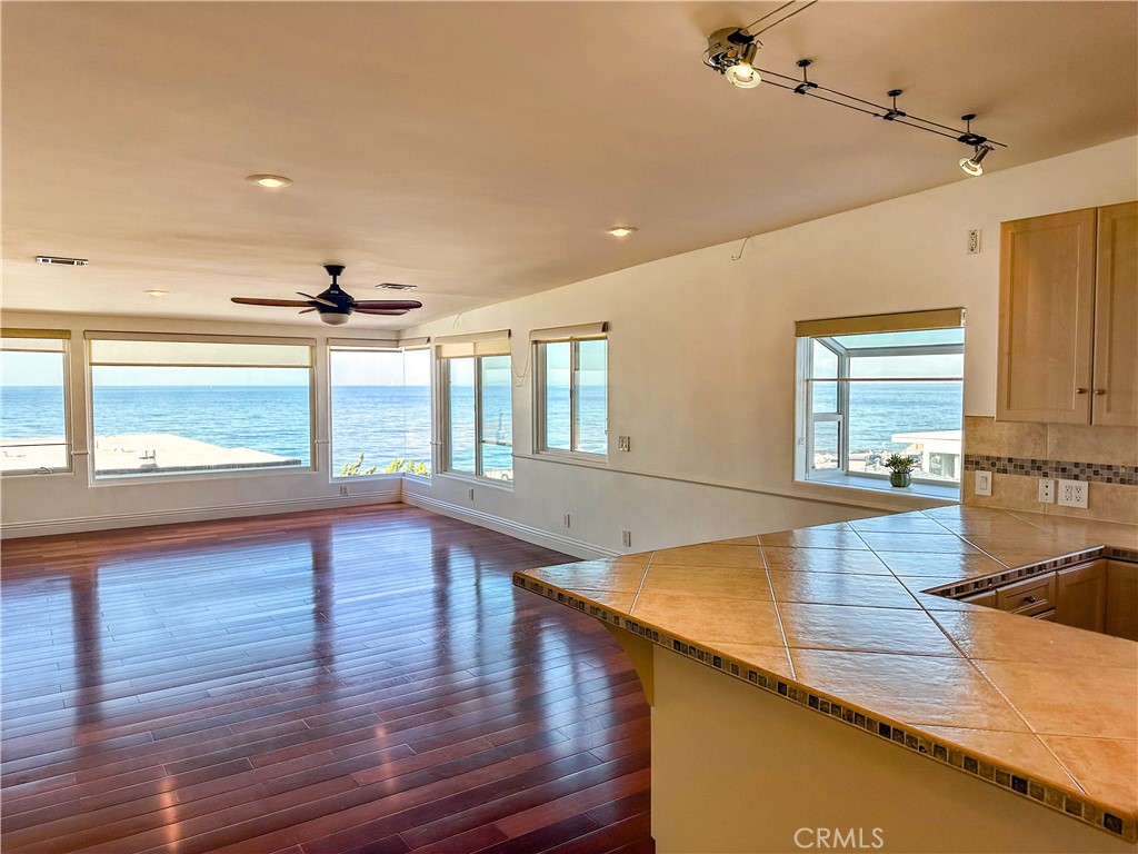 a view of kitchen with wooden floor and window