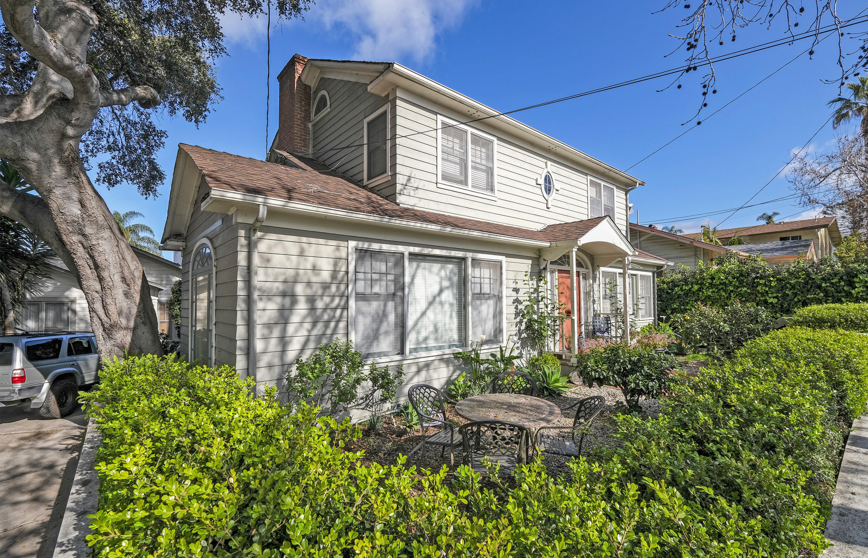 a front view of a house with garden