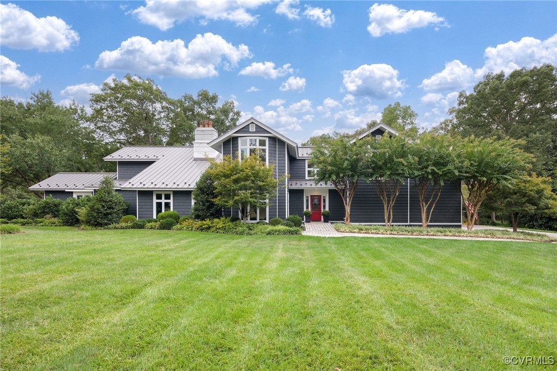 a front view of a house with a yard and porch