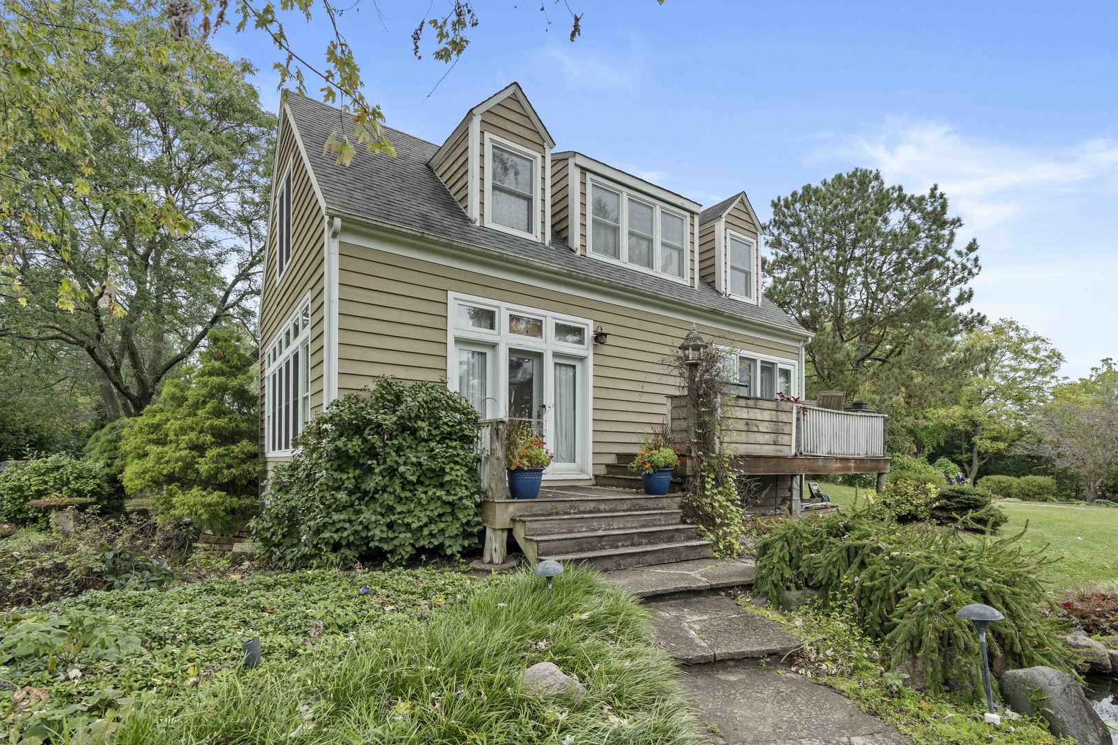 a front view of a house with garden