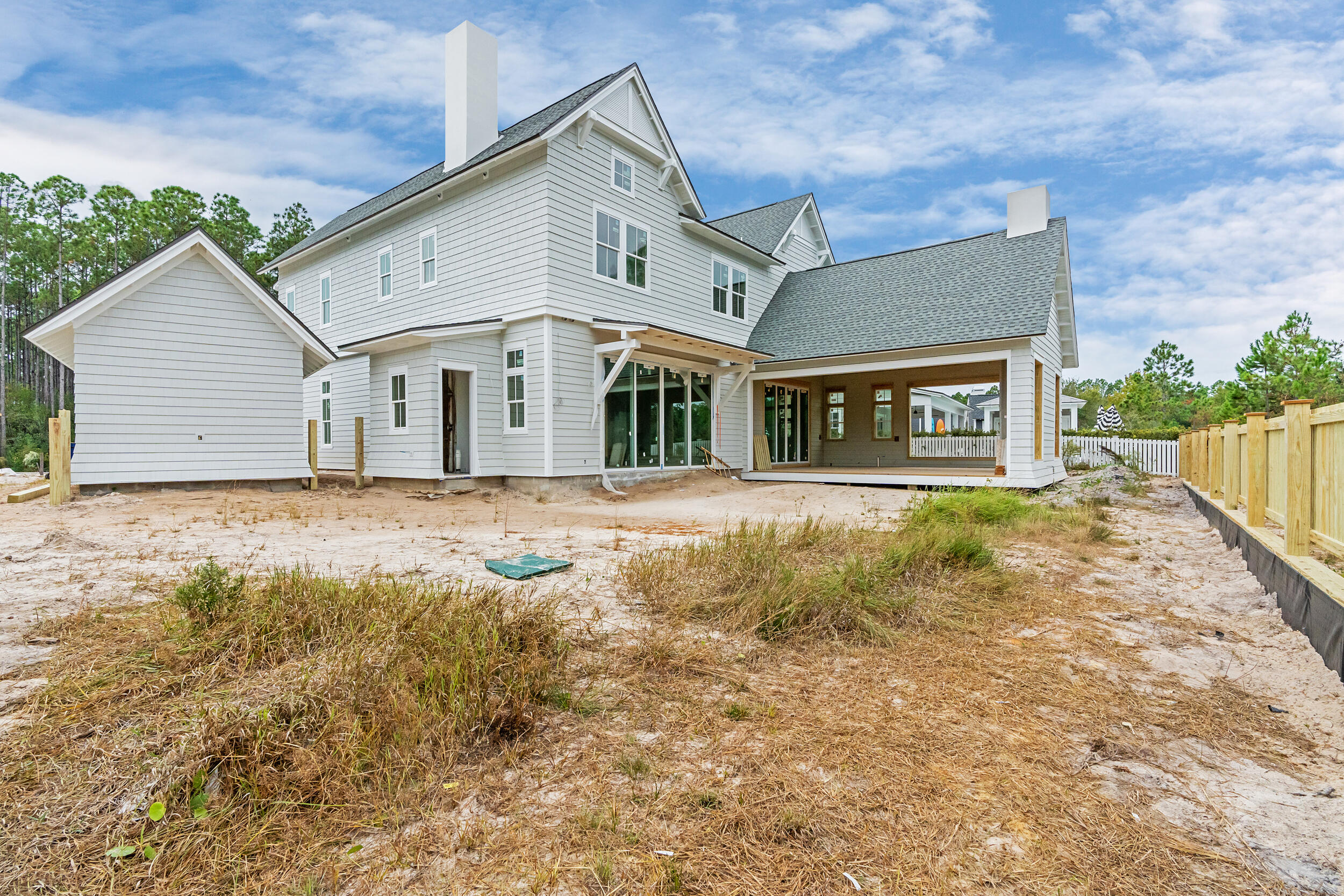 a front view of a house with large garden