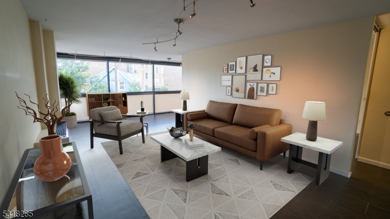 a living room with furniture and a lamp