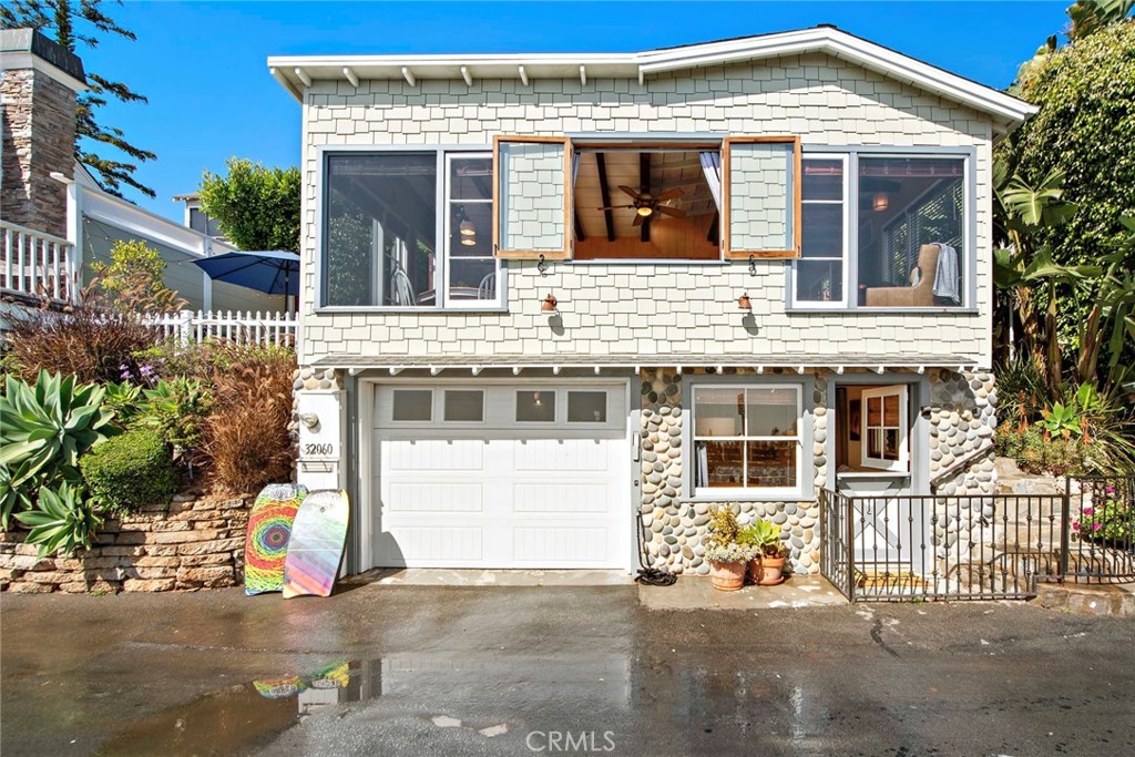 a front view of a house with a garage