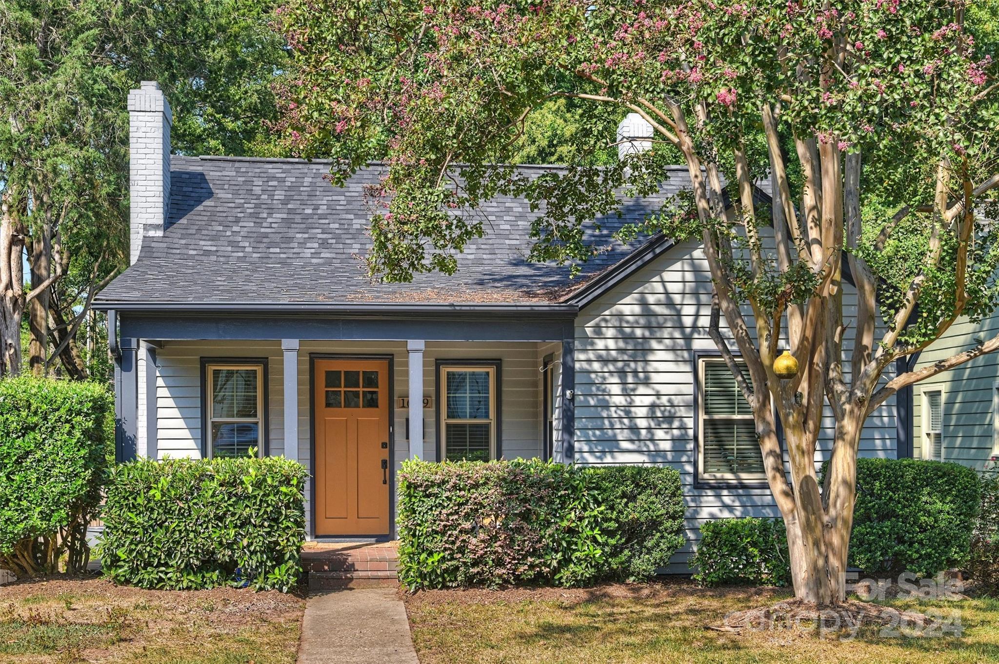 front view of a house with a garden