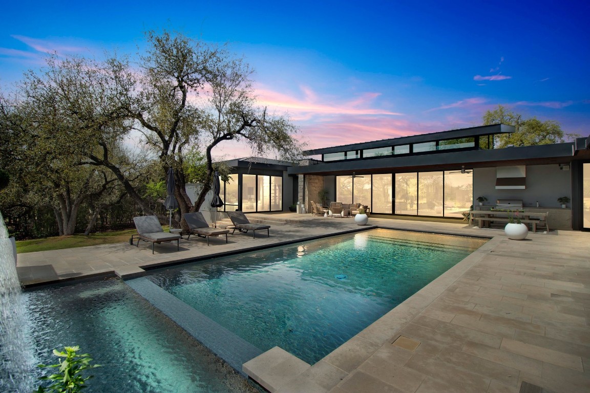 a view of swimming pool with lounge chair