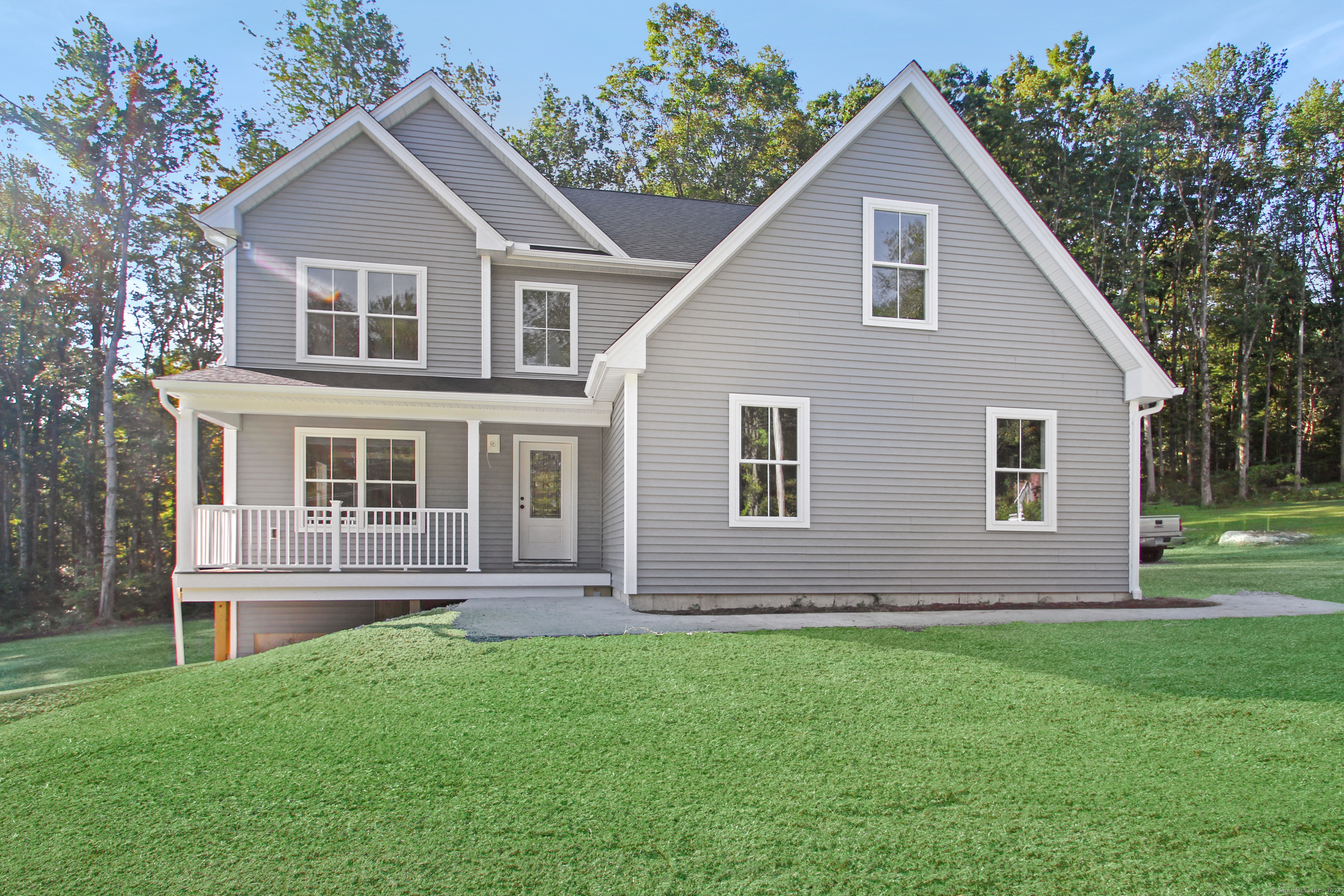 a front view of a house with a yard