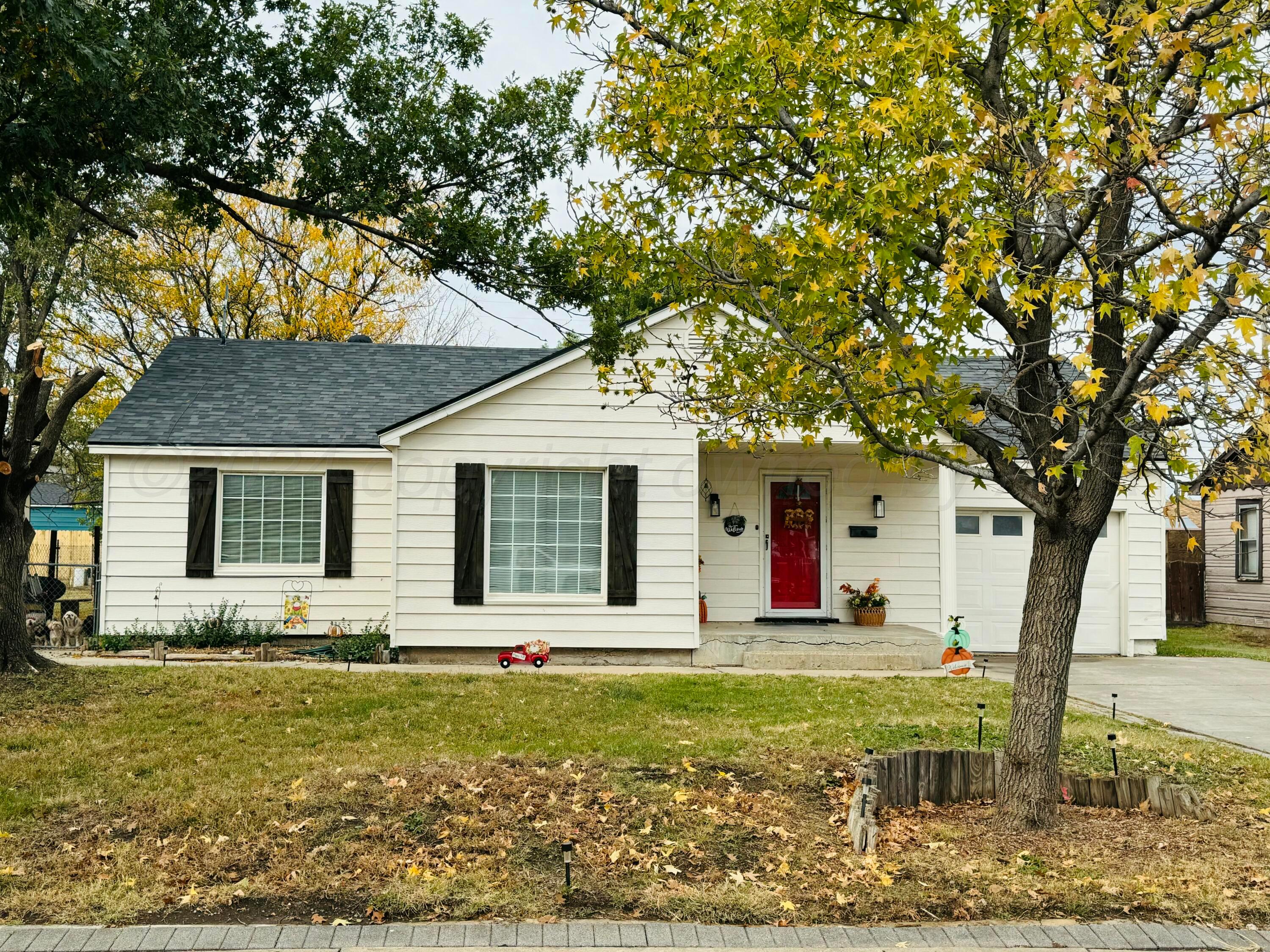 a house that has a tree in front of the house