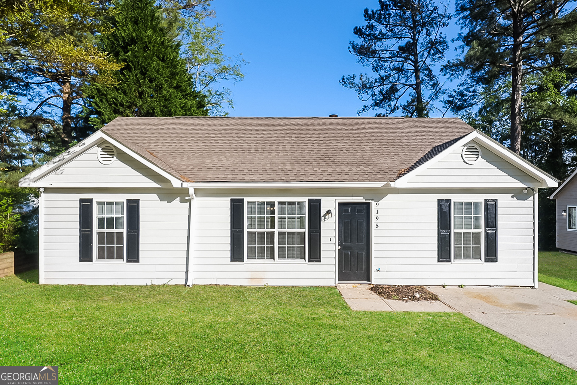 a view of house with yard