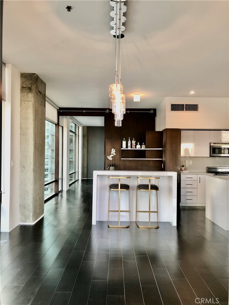 a kitchen with stainless steel appliances a stove and cabinets