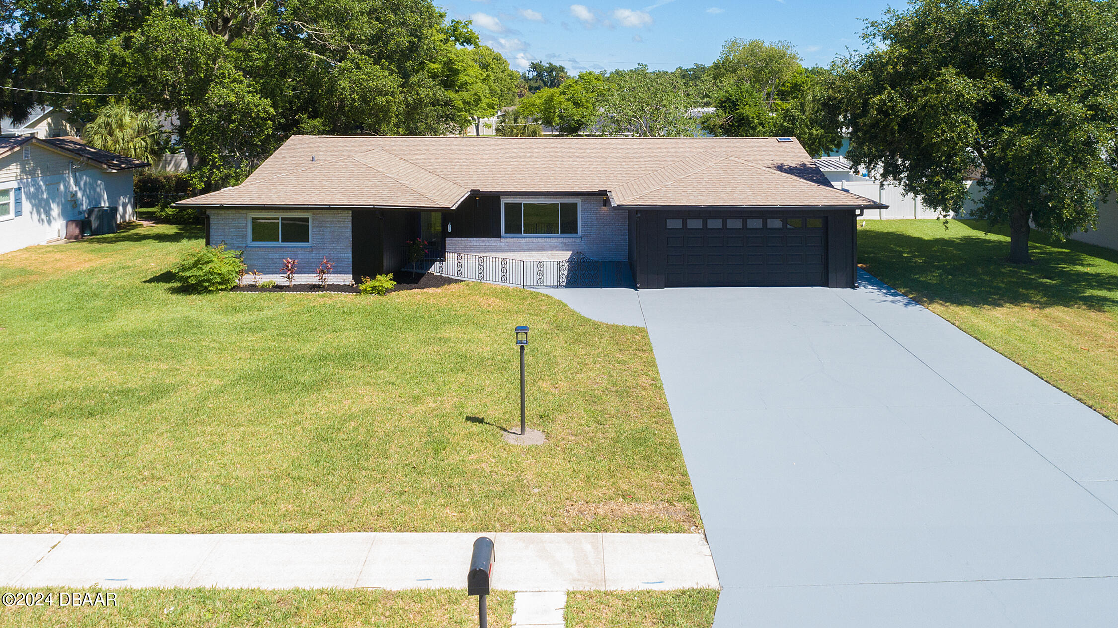 a aerial view of a house with swimming pool