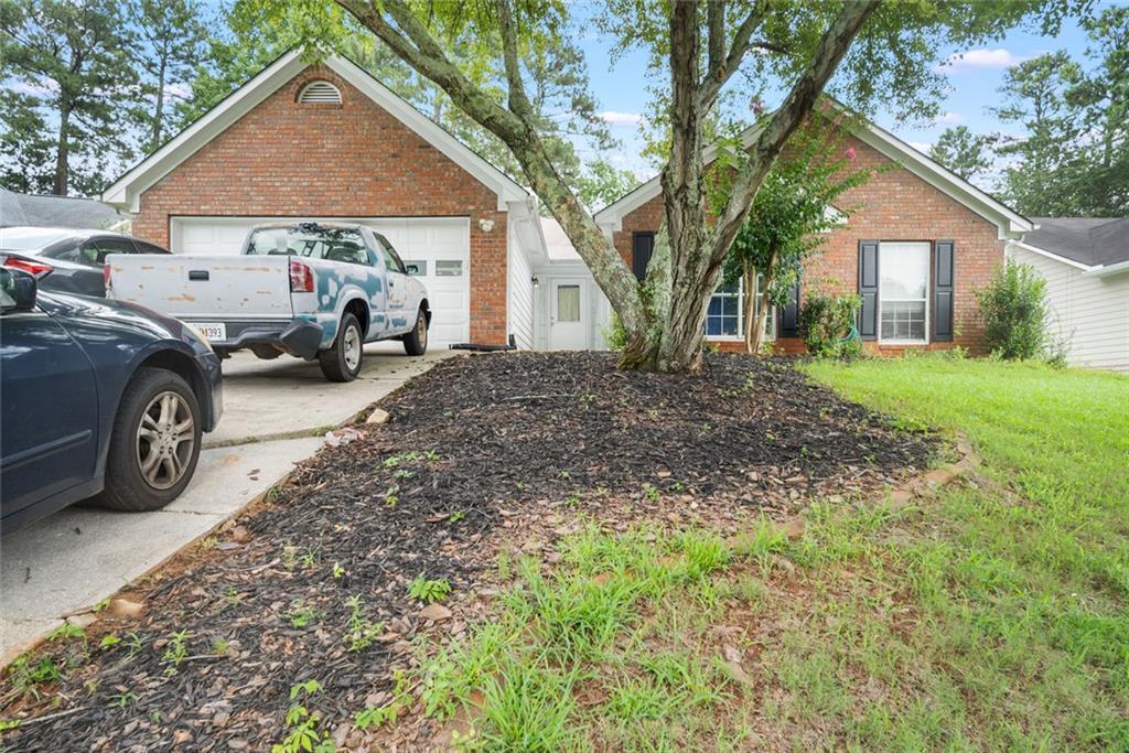 a view of a house with a back yard