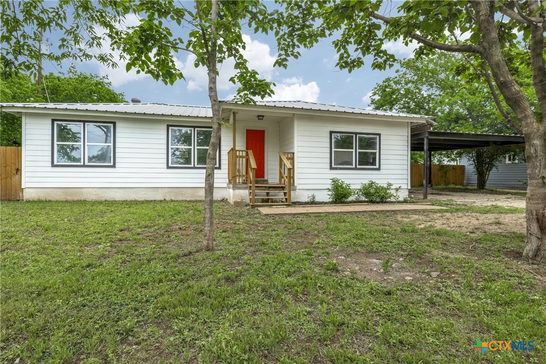 front view of a house with a yard