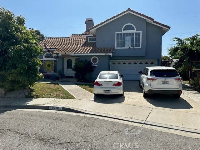 a car parked in front of a house