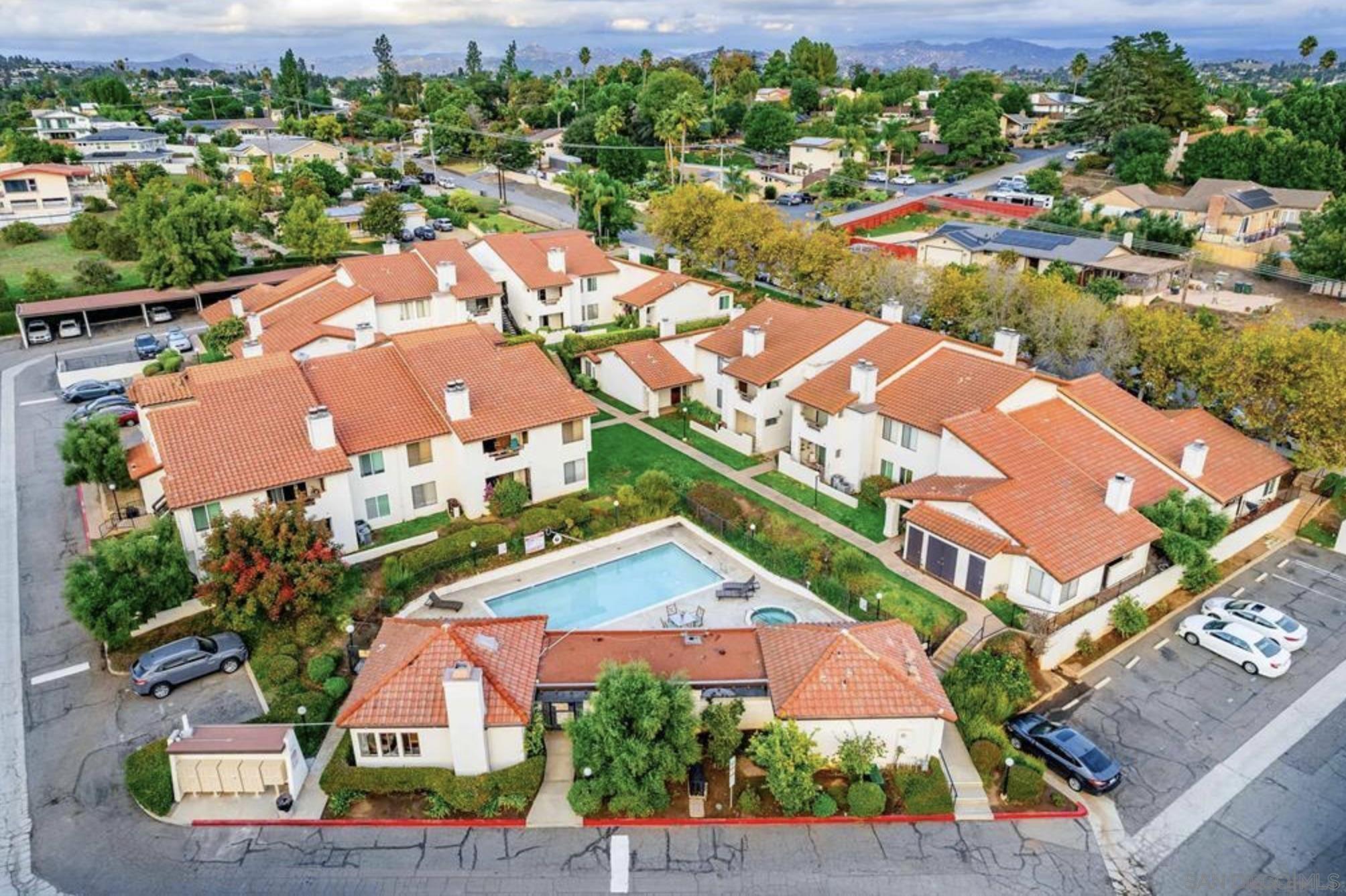 an aerial view of residential houses with outdoor space