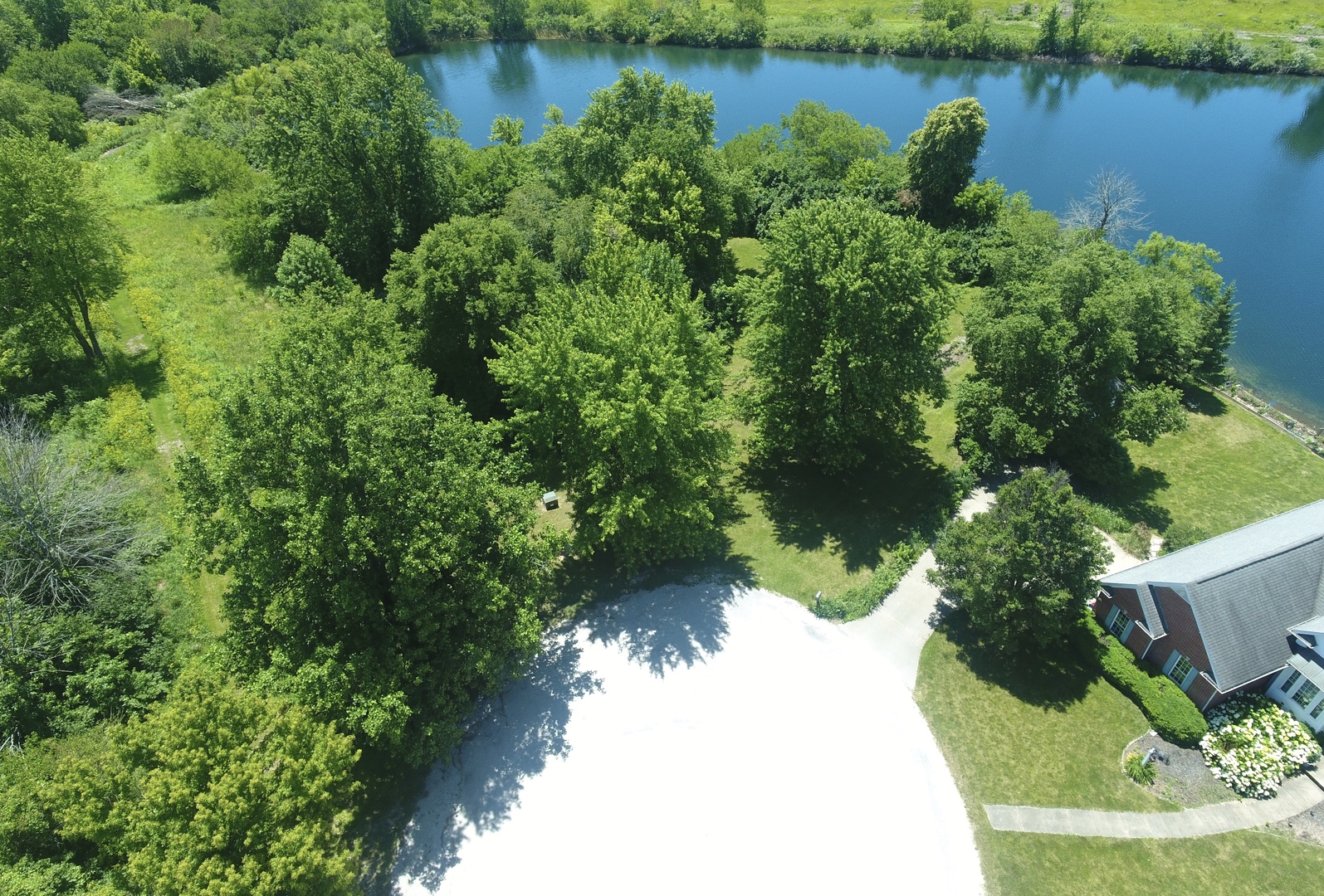 a view of a lake with a yard