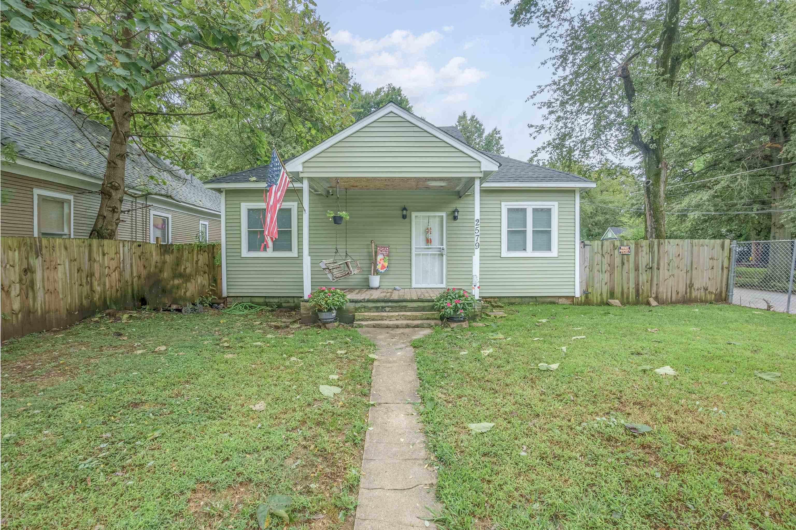 front view of a house with a yard