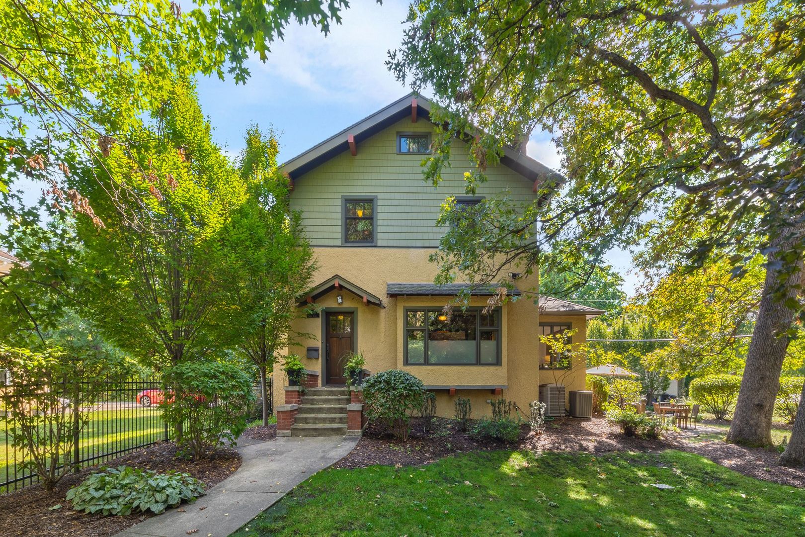 a front view of a house with garden