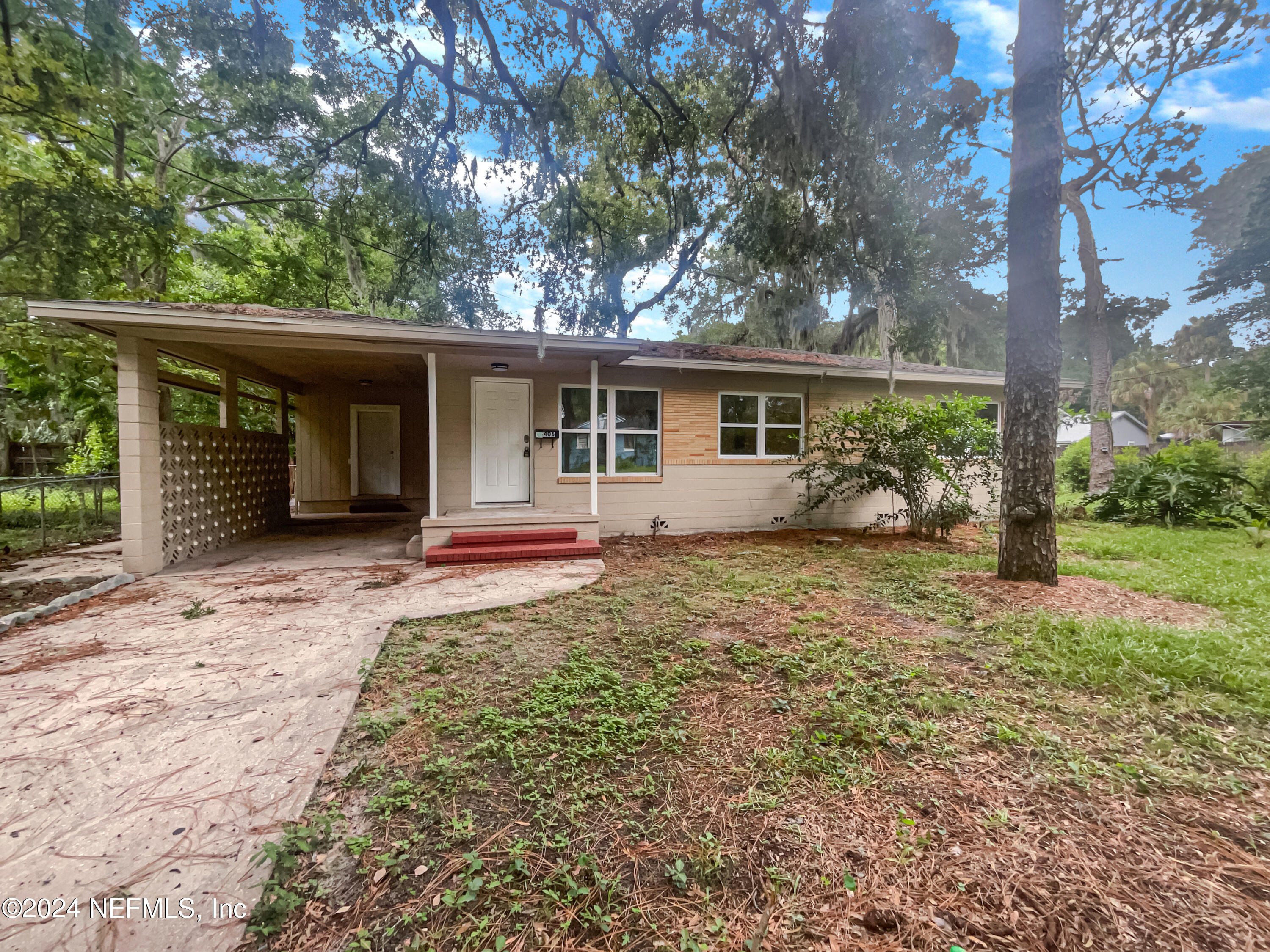 front view of a house with a yard