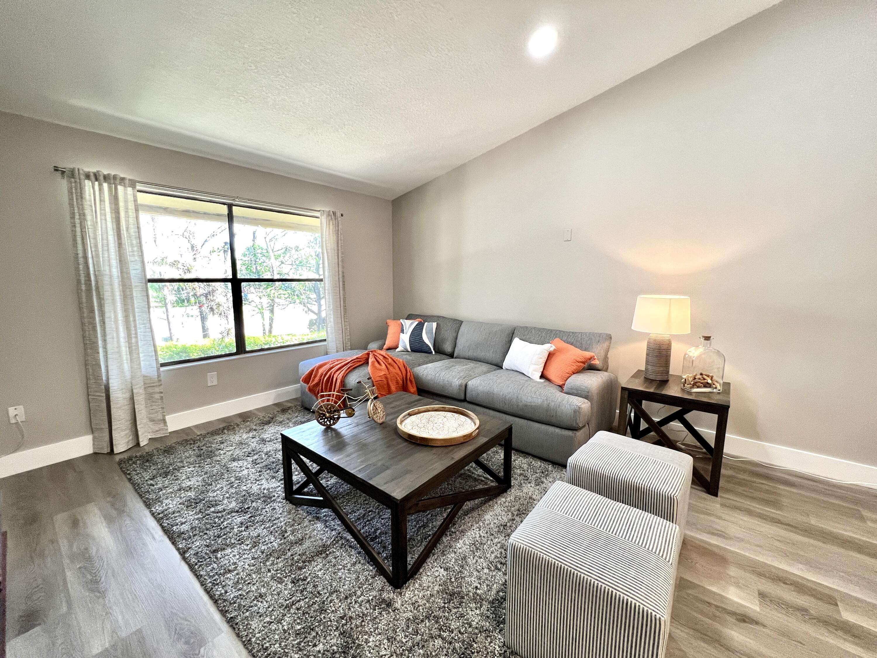 a living room with furniture and a window