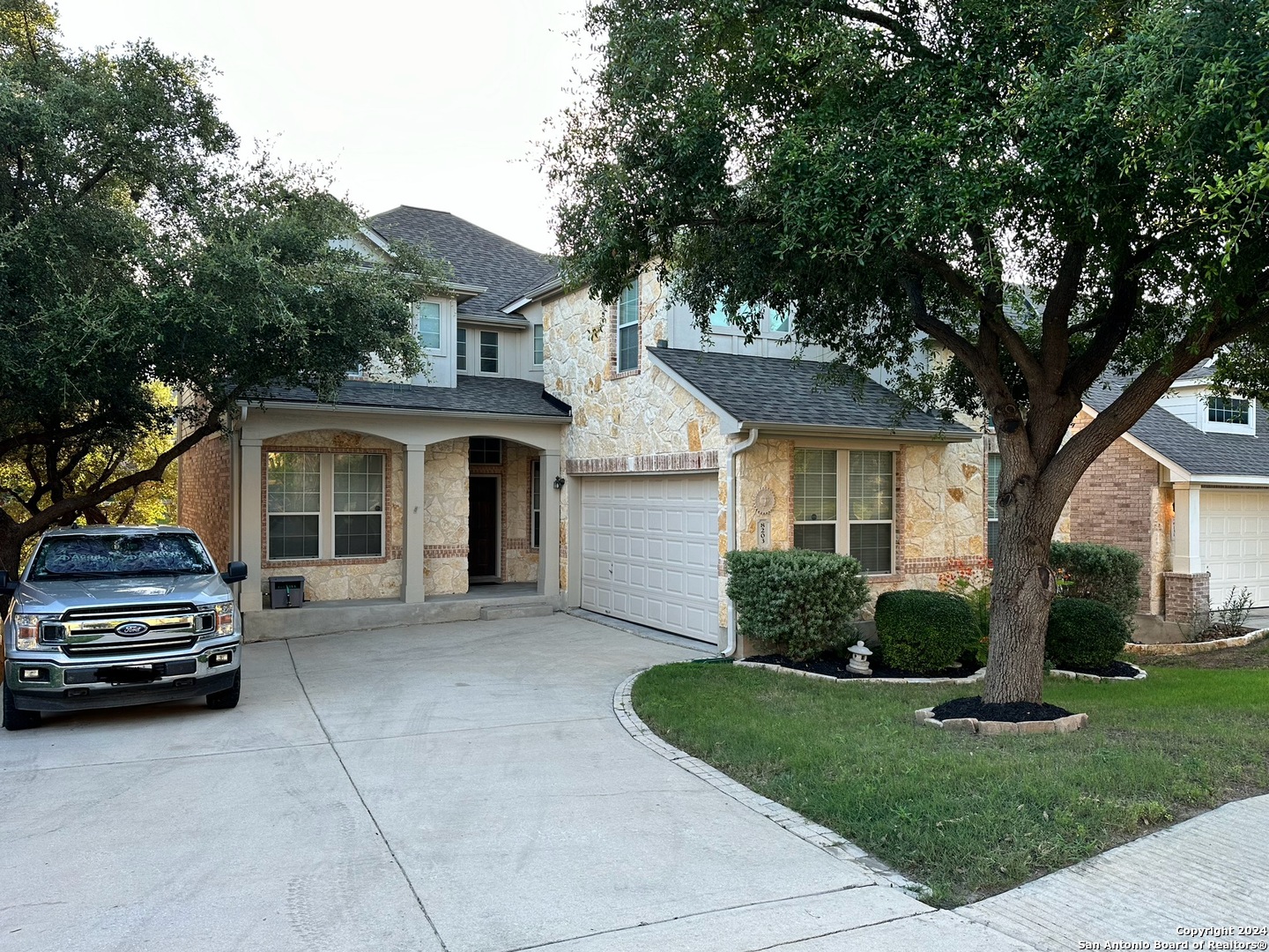 a house view with a garden space