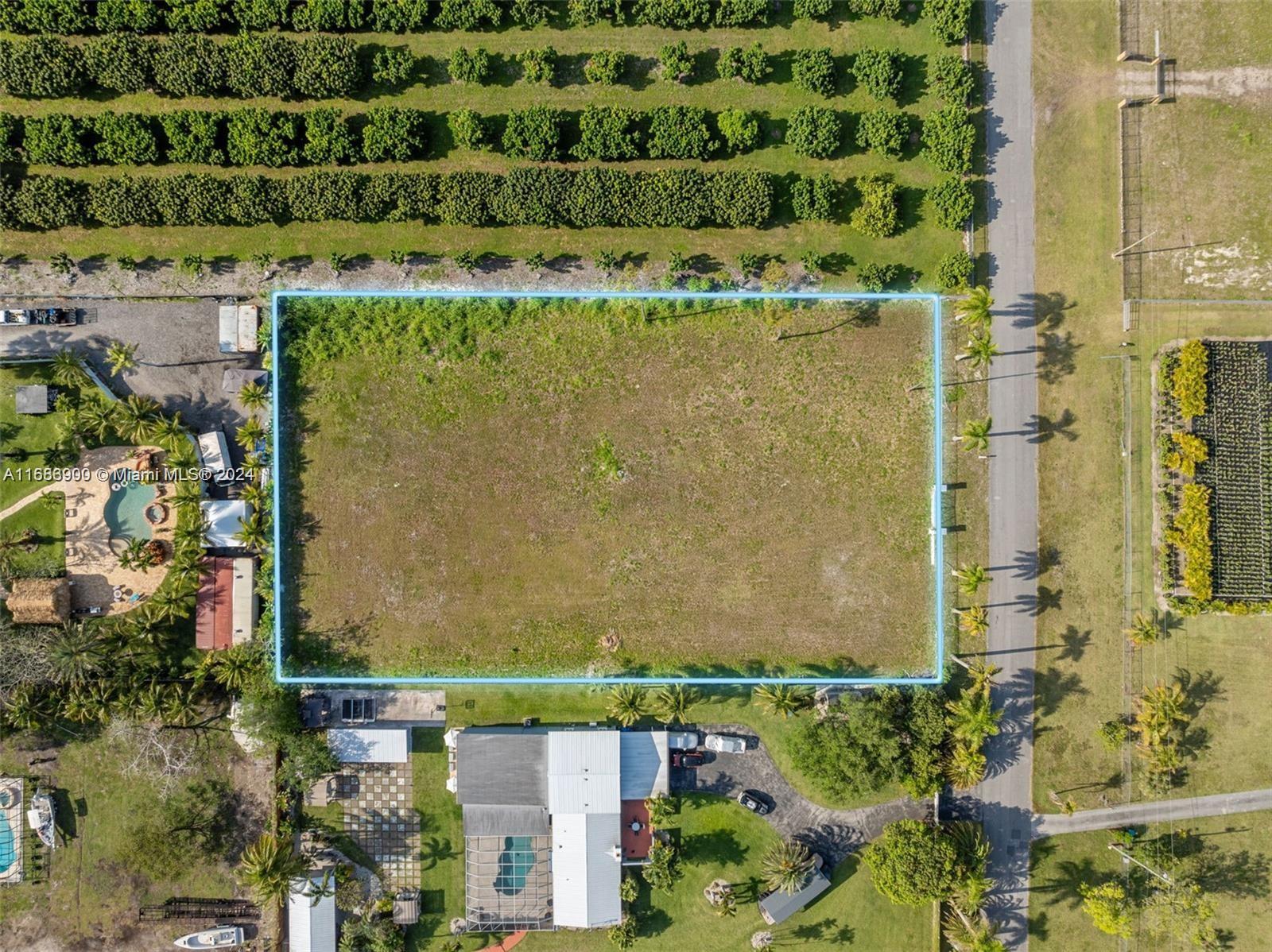 an aerial view of a residential apartment building with a yard