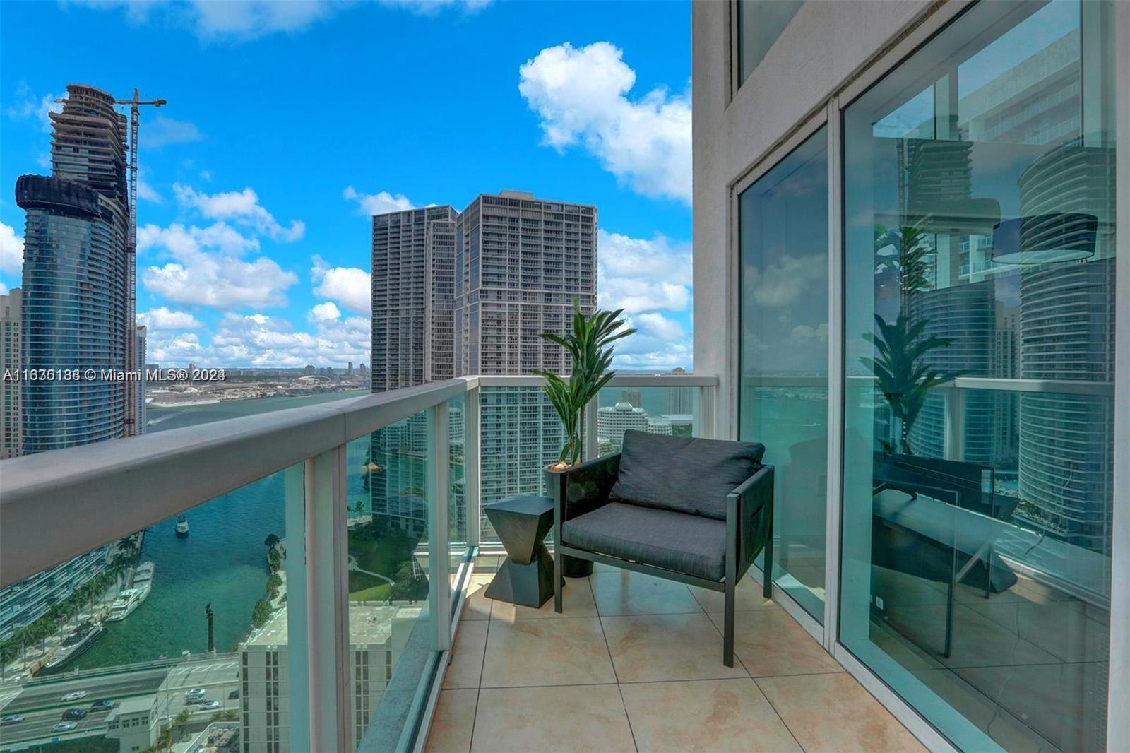 a view of two chairs in balcony