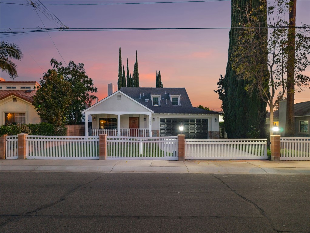 a front view of a house with a street