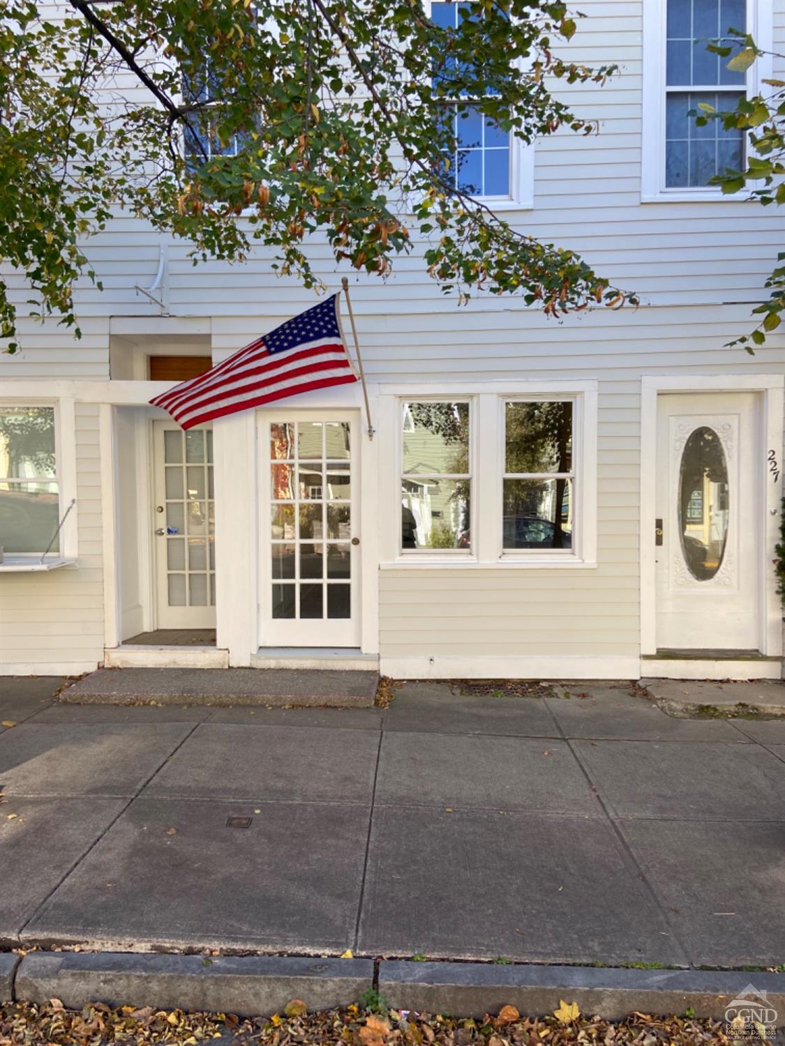 a front view of a house with a garage