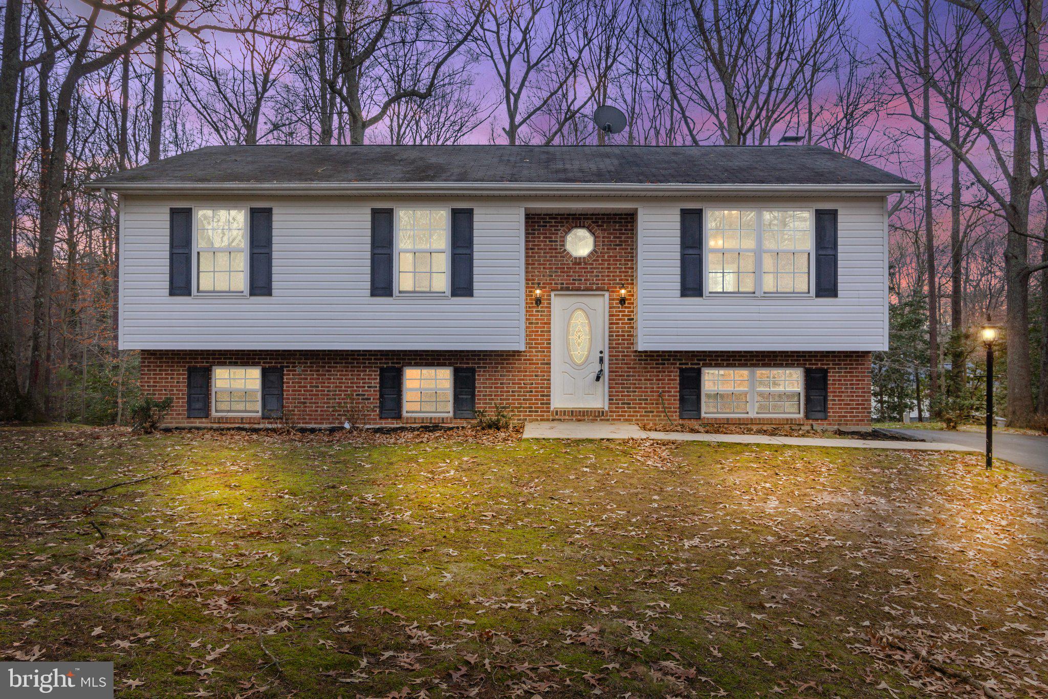 a front view of a house with yard