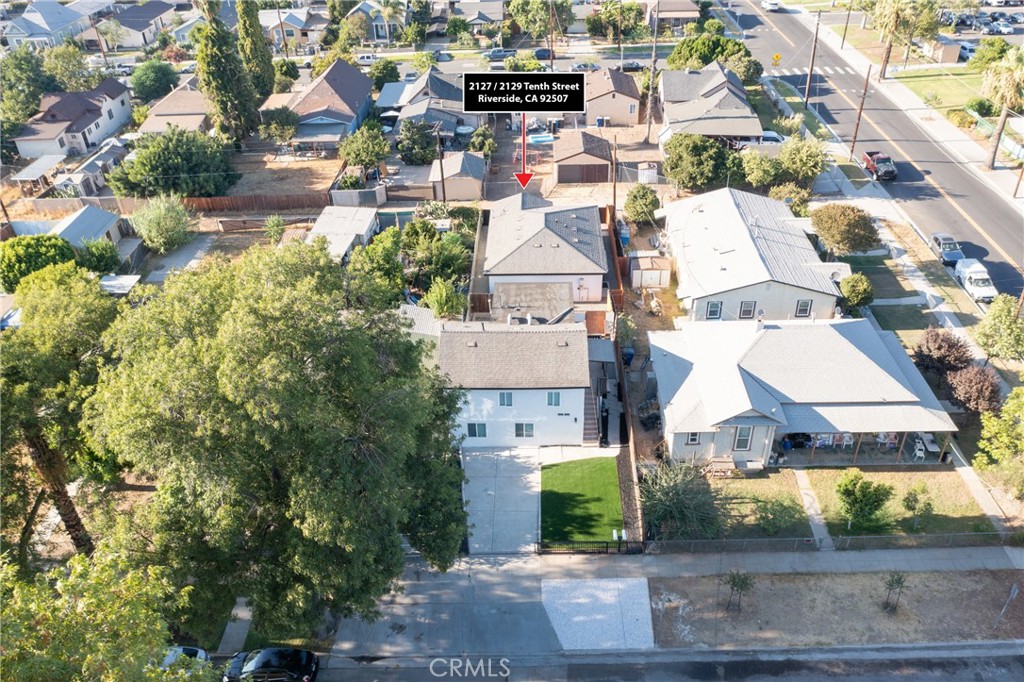 an aerial view of residential houses with outdoor space