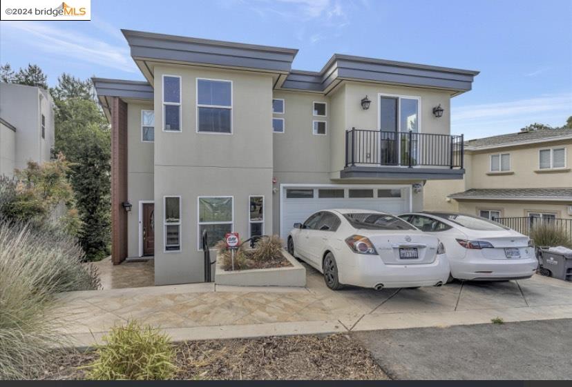 a front view of a house with parking space