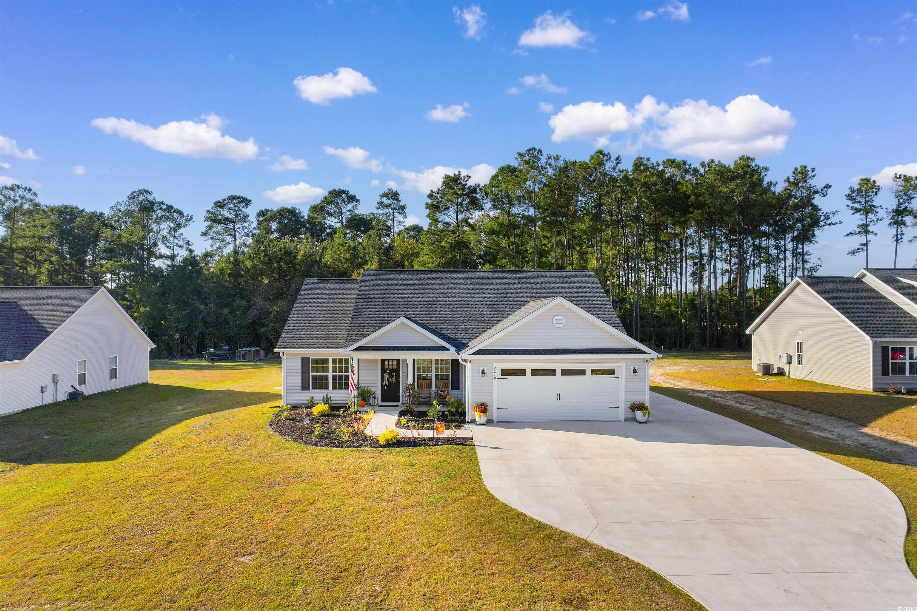 View of front of home featuring a front yard and a