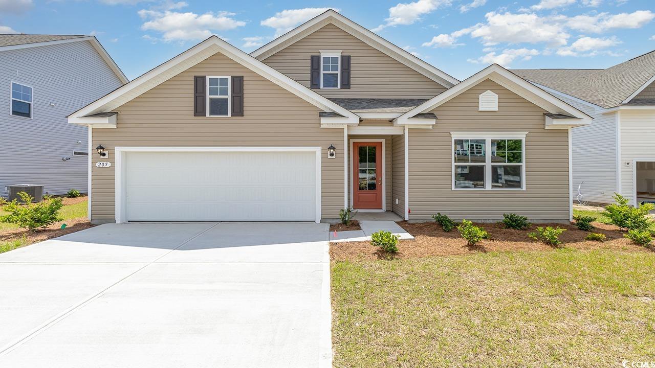 View of front of house featuring a garage, central