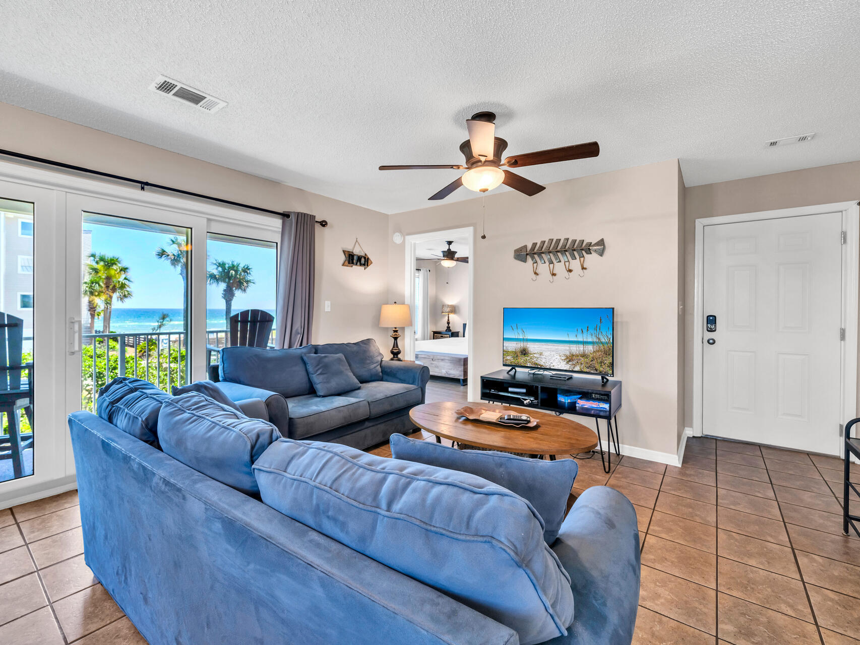 a living room with furniture and a flat screen tv