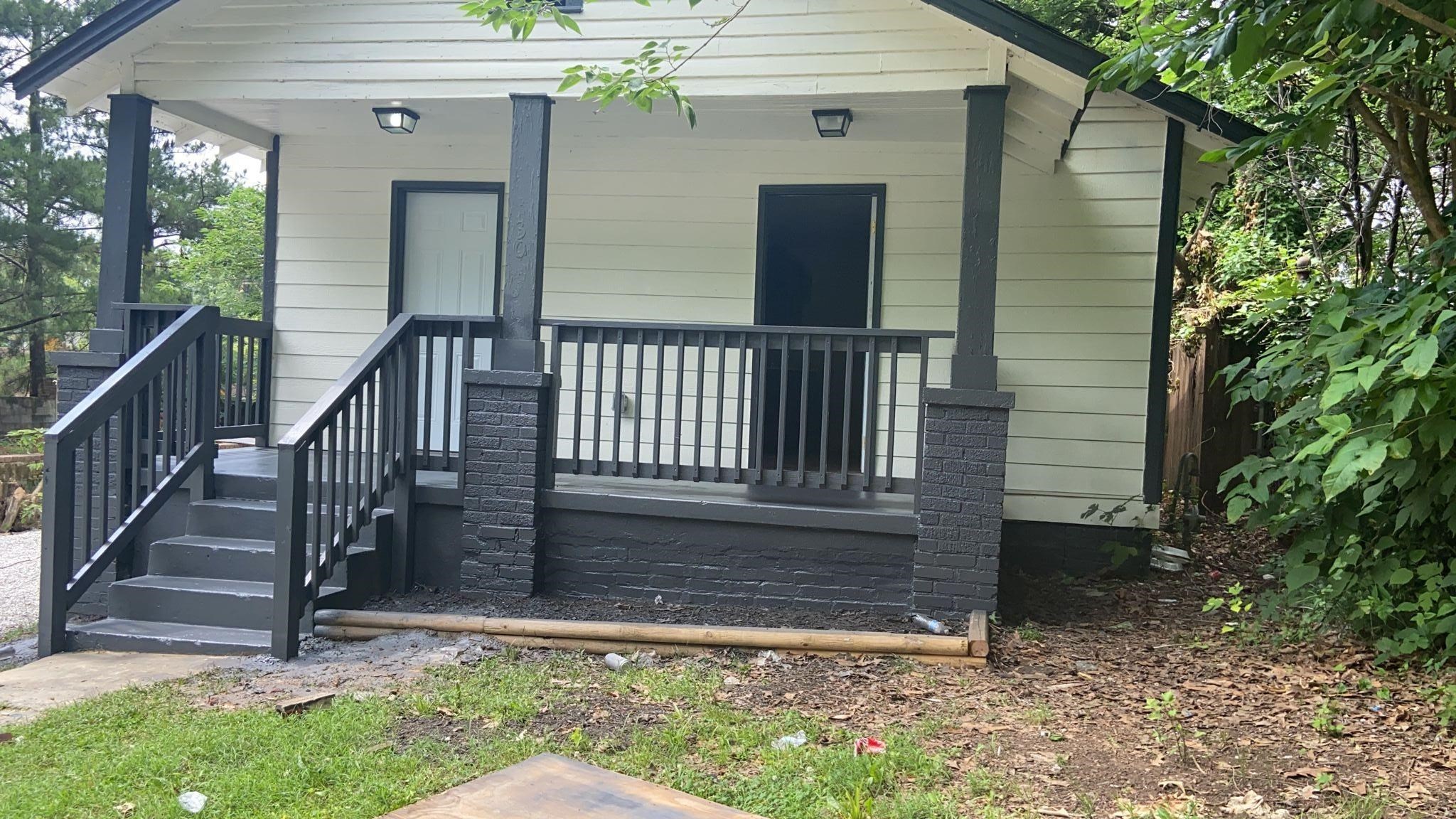 Back of house with covered porch