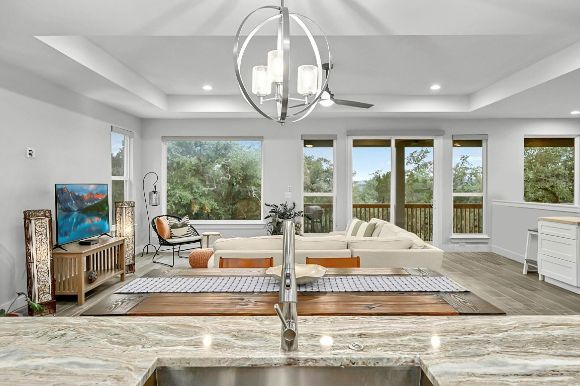 a living room with fireplace furniture and a floor to ceiling window