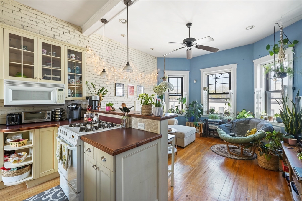 a kitchen with stove and cabinets