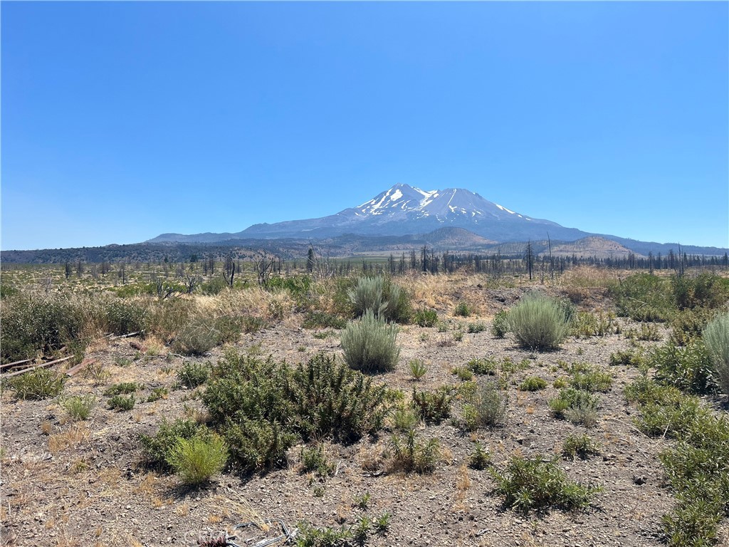 a view of a sky with mountains in the background