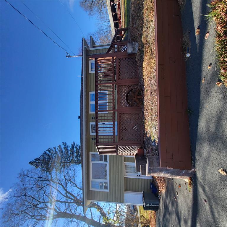 a view of house with yard