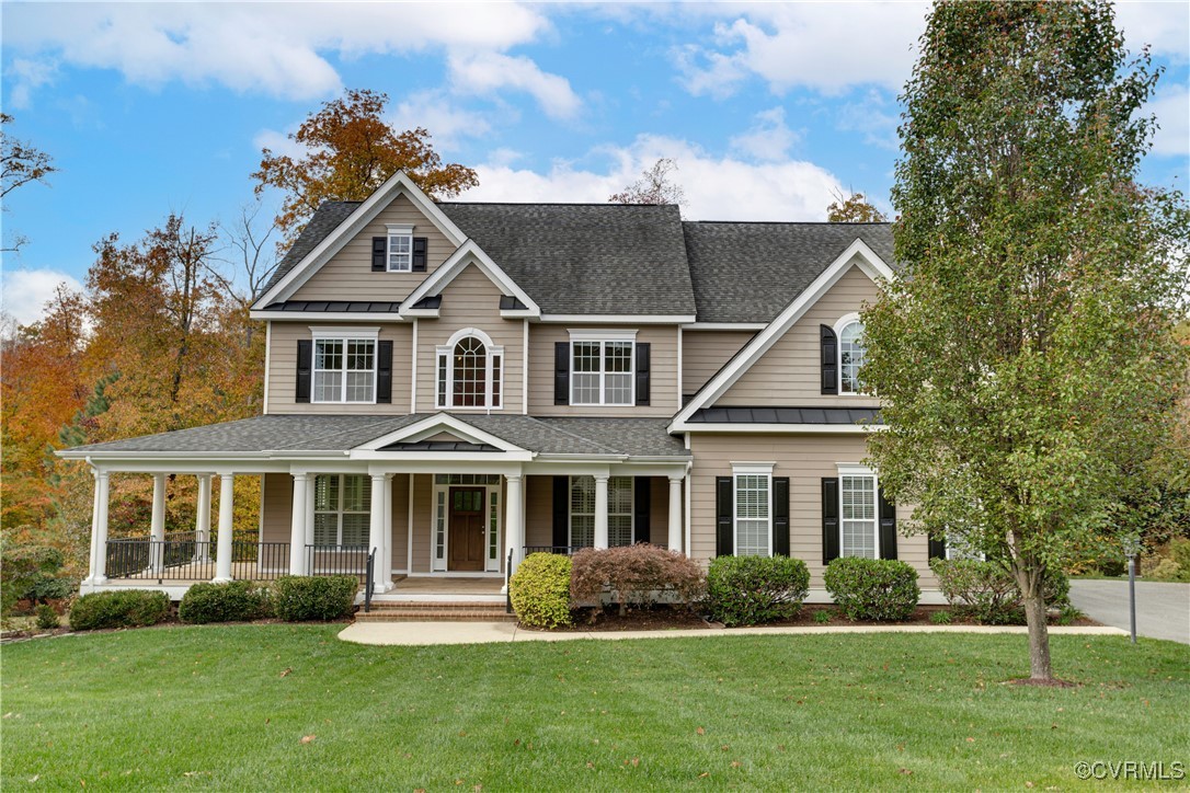 View of front of house featuring a front yard and